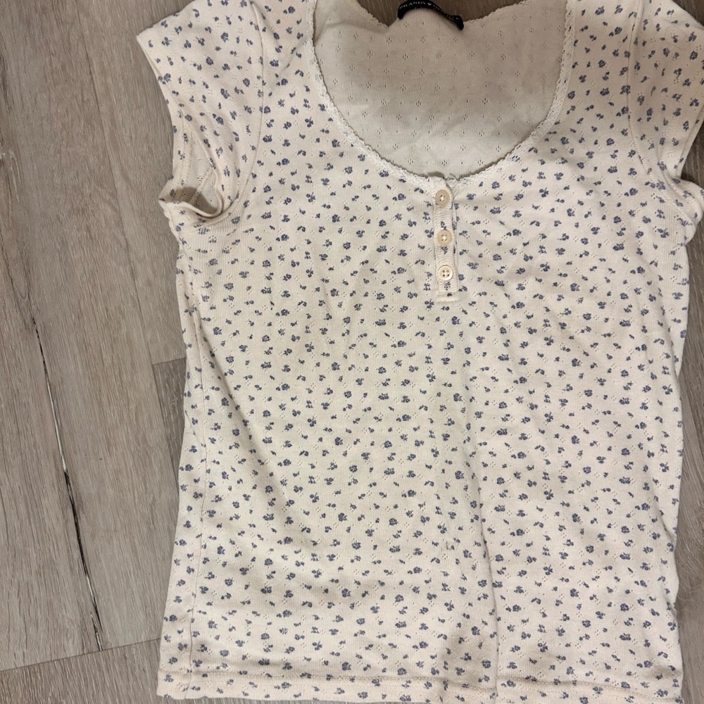 Brandy Melville Cream Tee with Blue Floral Design